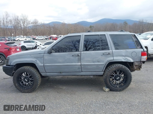 1995 Jeep Grand Cherokee Laredo with VIN 1J4GZ58S4SC778322, listed as a IAAI auction lot 41498800 with 255,058 mi miles. Bid and sale history available at carsss.com. Image 15.