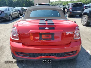2013 MINI Roadster S z VIN WMWSY3C58DT594039, wystawiony jako Copart lot #65833804 z przebiegiem Nie podano mil oraz Szkody całkowita. Historia ofert i sprzedaży dostępna na DreamBid. Obrazek 6.