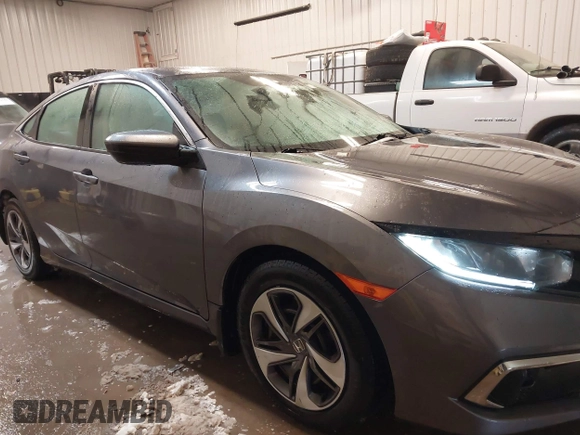 2020 Honda Civic LX z VIN 19XFC2F65LE030888, wystawiony jako IAAI lot #41609630 z przebiegiem 115 614 mil mil oraz . Historia ofert i sprzedaży dostępna na DreamBid. Obrazek 13.