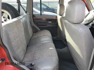 1996 Jeep Cherokee Country with VIN 1J4FJ78S5TL287631, listed as a Copart auction lot 79755834 with 195,365 mi miles and Salvage Title. Bid and sale history available at carsss.com. Image 10.