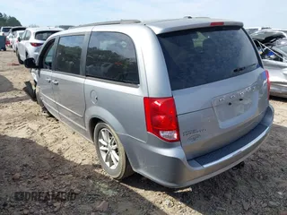 2014 Dodge Grand Caravan SXT with VIN 2C4RDGCG4ER106106, listed as a IAAI auction lot 41830512 with 135,044 mi miles and . Bid and sale history available at DreamBid. Image 3.