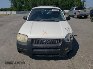 2004 Ford Escape XLS with VIN 1FMYU021X4DA07352, listed as a Copart auction lot 68909864 with 275,776 mi miles and Salvage Title. Bid and sale history available at carsss.com. Image 5.