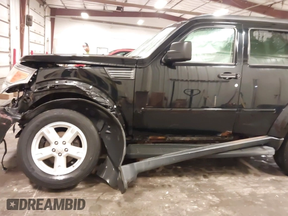 2007 Dodge Nitro SXT with VIN 1D8GU28K67W663621, listed as a IAAI auction lot 41691529 with 211,556 mi miles. Bid and sale history available at carsss.com. Image 18.