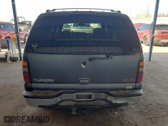 2001 GMC Yukon SLT z VIN 1GKEK13T21J165558, wystawiony jako Copart lot #52200565 z przebiegiem 291 699 mil mil oraz Szkoda całkowita • Salvage title. Historia ofert i sprzedaży dostępna na DreamBid. Obrazek 6.