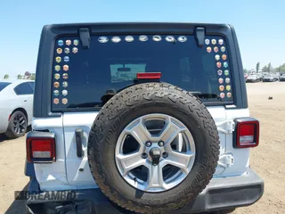 2018 Jeep Wrangler Unlimited Sport with VIN 1C4HJXDG4JW319142, listed as a IAAI auction lot 42702550 with 72,023 mi miles and . Bid and sale history available at DreamBid. Image 16.