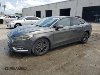 2018 Ford Fusion SE z VIN 3FA6P0HD8JR144173, wystawiony jako Copart lot #56325205 z przebiegiem 142 908 mil mil oraz Szkoda całkowita • Salvage title. Historia ofert i sprzedaży dostępna na DreamBid. Obrazek 1.