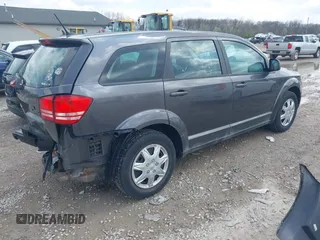 2014 Dodge Journey SE with VIN 3C4PDCAB1ET219760, listed as a IAAI auction lot 42013441 with 106,212 mi miles and . Bid and sale history available at carsss.com. Image 4.