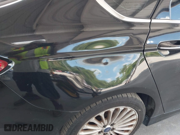 2016 Ford Fusion Titanium with VIN 3FA6P0K99GR235692, listed as a IAAI auction lot 42587743 with 169,467 mi miles and . Bid and sale history available at DreamBid. Image 6.