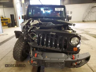 2013 Jeep Wrangler Rubicon with VIN 1C4HJWCG6DL666540, listed as a Copart auction lot 79337404 with 130,448 mi miles and Salvage title. Bid and sale history available at DreamBid. Image 5.