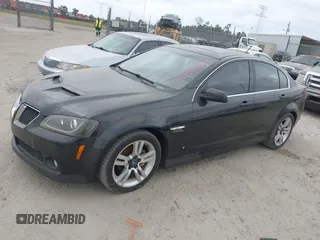 2009 Pontiac G8 with VIN 6G2ER57789L232134, listed as a IAAI auction lot 41864803 with 166,717 mi miles. Bid and sale history available at carsss.com. Image 2.