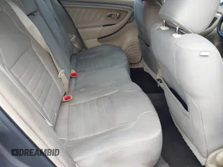 2014 Ford Taurus SE z VIN 1FAHP2D88EG143275, wystawiony jako IAAI lot #41801787 z przebiegiem 150 988 mil mil oraz . Historia ofert i sprzedaży dostępna na DreamBid. Obrazek 8.
