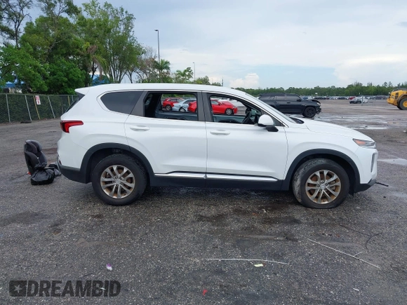 2019 Hyundai Santa Fe SE with VIN 5NMS23ADXKH038506, listed as a IAAI auction lot 42407399 with 54,540 mi miles and . Bid and sale history available at DreamBid. Image 14.