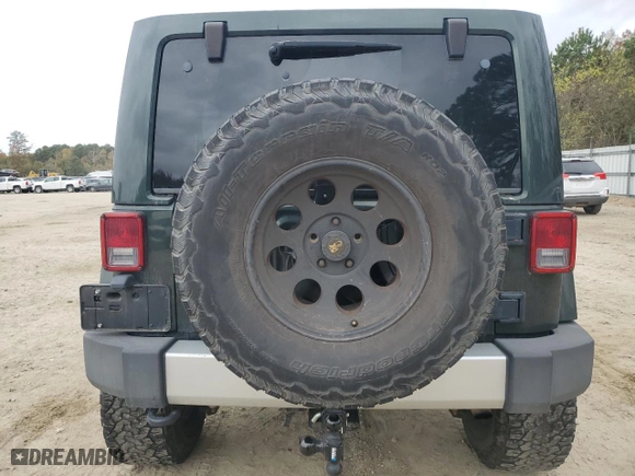 2011 Jeep Wrangler Unlimited Sahara with VIN 1J4BA5H16BL557068, listed as a Copart auction lot 80429454 with 142,428 mi miles and Salvage Title. Bid and sale history available at carsss.com. Image 6.
