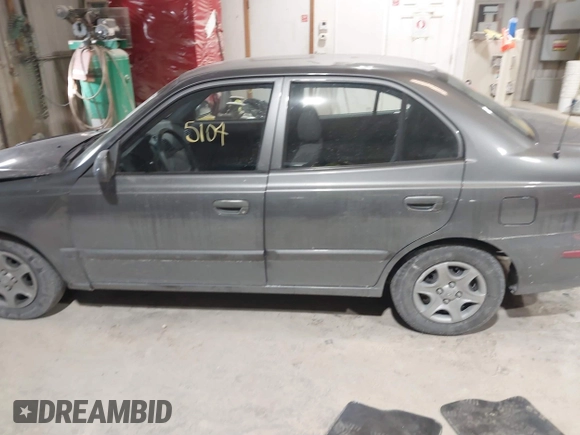 2004 Hyundai Accent GL with VIN KMHCG45C44U528783, listed as a IAAI auction lot 41535104 with 1 mi miles. Bid and sale history available at carsss.com. Image 14.