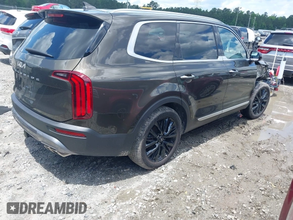 2022 Kia Telluride SX with VIN 5XYP5DHC3NG306763, listed as a IAAI auction lot 42267394 with 110,000 mi miles and . Bid and sale history available at DreamBid. Image 4.