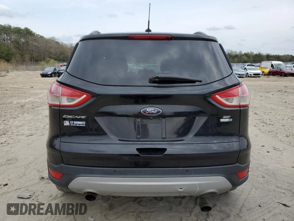2016 Ford Escape SE with VIN 1FMCU9GX5GUB02417, listed as a Copart auction lot 51762985 with 97,535 mi miles and Salvage Title. Bid and sale history available at DreamBid. Image 6.