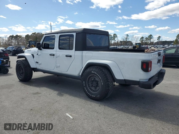 2023 Jeep Gladiator Sport S with VIN 1C6HJTAG4PL556387, listed as a Copart auction lot 47453305 with 35,611 mi miles and Salvage title. Bid and sale history available at DreamBid. Image 2.