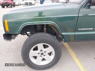 1999 Jeep Cherokee Sport z VIN 1J4FT68S1XL667138, wystawiony jako IAAI lot #42651020 z przebiegiem 200 324 mil mil oraz . Historia ofert i sprzedaży dostępna na DreamBid. Obrazek 6.