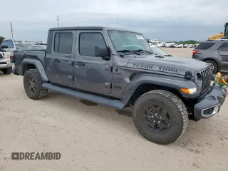 2021 Jeep Gladiator Willys с VIN 1C6HJTAG9ML606731, выставлен на аукционе Copart как лот 59873205 с пробегом 84 811 миль миль и Списание • Salvage title. История ставок и продаж доступна на DreamBid. Изображение 4.