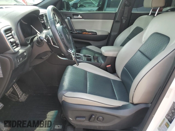 2019 Kia Sportage EX z VIN KNDPNCAC7K7522953, wystawiony jako Copart lot #54906835 z przebiegiem 128 011 mil mil oraz Szkoda całkowita • Salvage title. Historia ofert i sprzedaży dostępna na DreamBid. Obrazek 7.