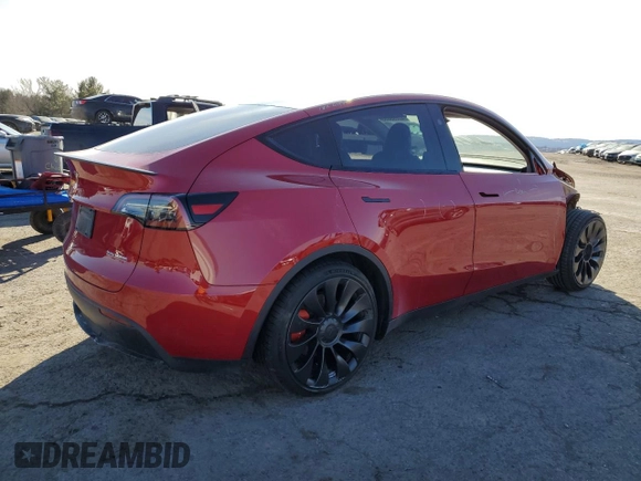 2023 Tesla Model Y Performance with VIN 7SAYGDEFXPF790747, listed as a Copart auction lot 42233855 with 25,452 mi miles and Salvage Title. Bid and sale history available at DreamBid. Image 3.