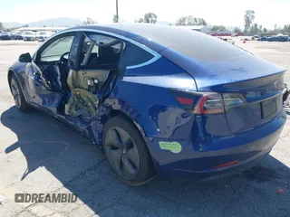 2020 Tesla Model 3 Standard Range Plus with VIN 5YJ3E1EA1LF590396, listed as a IAAI auction lot 41868089 with 51,278 mi miles. Bid and sale history available at carsss.com. Image 3.