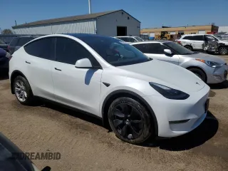 2023 Tesla Model Y Long Range z VIN 7SAYGDEE3PF772663, wystawiony jako Copart lot #56470455 z przebiegiem 50 705 mil mil oraz Czysty tytuł • Clean title. Historia ofert i sprzedaży dostępna na DreamBid. Obrazek 4.