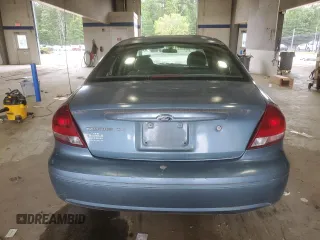 2007 Ford Taurus SE with VIN 1FAFP53U17A215432, listed as a Copart auction lot 64029215 with 121,190 mi miles and Salvage title. Bid and sale history available at DreamBid. Image 6.