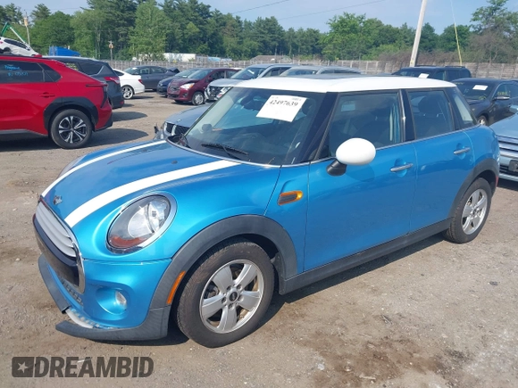 2015 MINI Hardtop 4 Door z VIN WMWXS5C51FT829693, wystawiony jako IAAI lot #42497639 z przebiegiem 36 494 mil mil oraz . Historia ofert i sprzedaży dostępna na DreamBid. Obrazek 2.