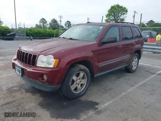 2007 Jeep Grand Cherokee Laredo with VIN 1J8GR48K27C535382, listed as a IAAI auction lot 42013097 with 180,554 mi miles. Bid and sale history available at carsss.com. Image 2.