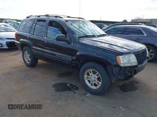1999 Jeep Grand Cherokee Limited with VIN 1J4GW68NXXC637464, listed as a IAAI auction lot 41561690 with 235,728 mi miles. Bid and sale history available at carsss.com. Image 1.