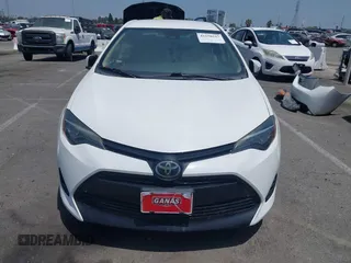 2018 Toyota Corolla L with VIN 5YFBURHE7JP810444, listed as a IAAI auction lot 42558647 with 74,794 mi miles and . Bid and sale history available at DreamBid. Image 13.