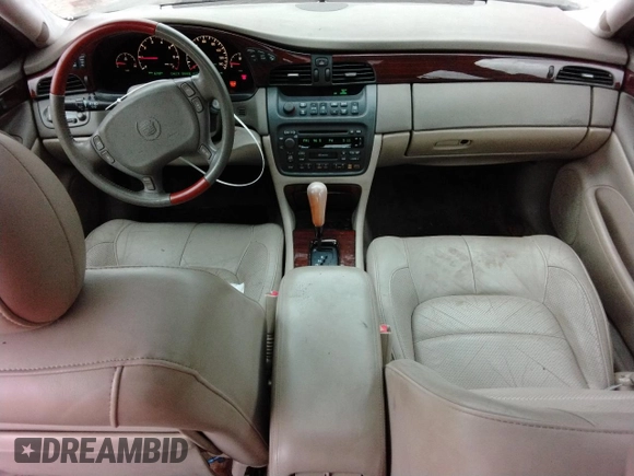 2000 Cadillac DeVille DTS z VIN 1G6KF5794YU249059, wystawiony jako Copart lot #71614494 z przebiegiem 121 611 mil mil oraz Szkoda całkowita • Salvage title. Historia ofert i sprzedaży dostępna na DreamBid. Obrazek 8.