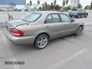 1999 Mazda 626 ES with VIN 1YVGF22C8X5900510, listed as a IAAI auction lot 41479213 with 178,182 mi miles. Bid and sale history available at carsss.com. Image 4.