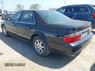 1998 Cadillac Seville STS z VIN 1G6KY5499WU916185, wystawiony jako IAAI lot #42035783 z przebiegiem 164 763 mil mil oraz . Historia ofert i sprzedaży dostępna na DreamBid. Obrazek 3.