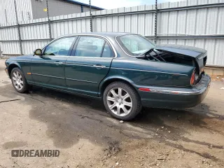 2004 Jaguar XJ with VIN SAJWA71C34SG16508, listed as a Copart auction lot 66751644 with 179,039 mi miles and Salvage Title. Bid and sale history available at carsss.com. Image 2.