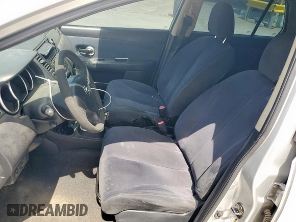2009 Nissan Versa S with VIN 3N1BC11E39L376873, listed as a Copart auction lot 60299465 with 134,769 mi miles and Salvage title. Bid and sale history available at DreamBid. Image 7.