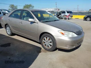 2002 Toyota Camry XLE z VIN JTDBF30K920030756, wystawiony jako IAAI lot #42084253 z przebiegiem 161 456 mil mil oraz . Historia ofert i sprzedaży dostępna na DreamBid. Obrazek 1.