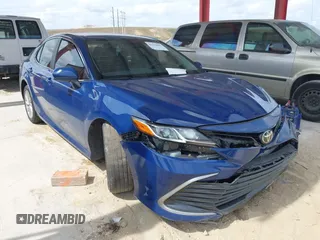 2023 Toyota Camry LE z VIN 4T1C11AK2PU081310, wystawiony jako IAAI lot #42214401 z przebiegiem 69 269 mil mil oraz . Historia ofert i sprzedaży dostępna na DreamBid. Obrazek 1.