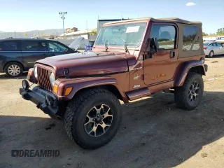 2002 Jeep Wrangler Sahara with VIN 1J4FA59S92P708647, listed as a Copart auction lot 74851654 with 131,794 mi miles and Salvage Title. Bid and sale history available at carsss.com. Image 1.