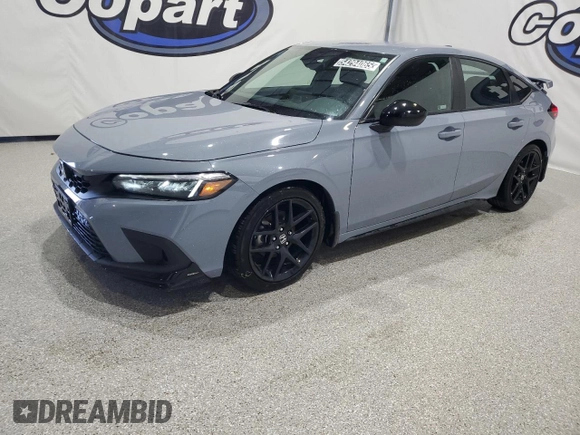 2023 Honda Civic Sport z VIN 19XFL2H89PE020319, wystawiony jako Copart lot #54294065 z przebiegiem 11 192 mil mil oraz Czysty tytuł • Clean title. Historia ofert i sprzedaży dostępna na DreamBid. Obrazek 1.