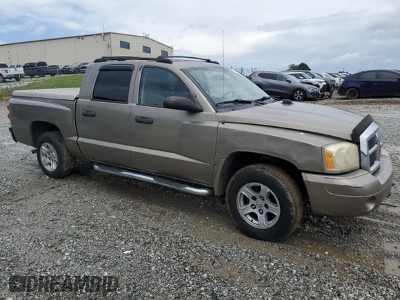 2006 Dodge Dakota SLT with VIN 1D7HE48N66S641149, listed as a Copart auction lot 58823615 with 169,002 mi miles and Salvage title. Bid and sale history available at DreamBid. Image 4.