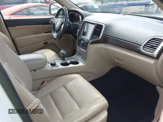 2014 Jeep Grand Cherokee Limited z VIN 1C4RJFBG9EC122590, wystawiony jako IAAI lot #42037881 z przebiegiem 137 270 mil mil oraz . Historia ofert i sprzedaży dostępna na DreamBid. Obrazek 5.