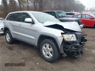 2013 Jeep Grand Cherokee Laredo with VIN 1C4RJFAGXDC537367, listed as a IAAI auction lot 41906921 with 124,679 mi miles. Bid and sale history available at carsss.com. Image 1.