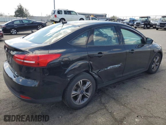 2018 Ford Focus SE with VIN 1FADP3FEXJL215912, listed as a Copart auction lot 50518385 with 100,080 mi miles and Salvage Title. Bid and sale history available at carsss.com. Image 3.