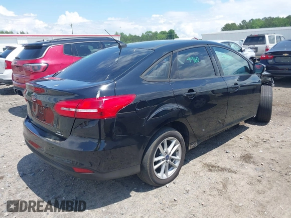 2016 Ford Focus SE with VIN 1FADP3F29GL256160, listed as a IAAI auction lot 42188124 with 72,868 mi miles and . Bid and sale history available at DreamBid. Image 4.