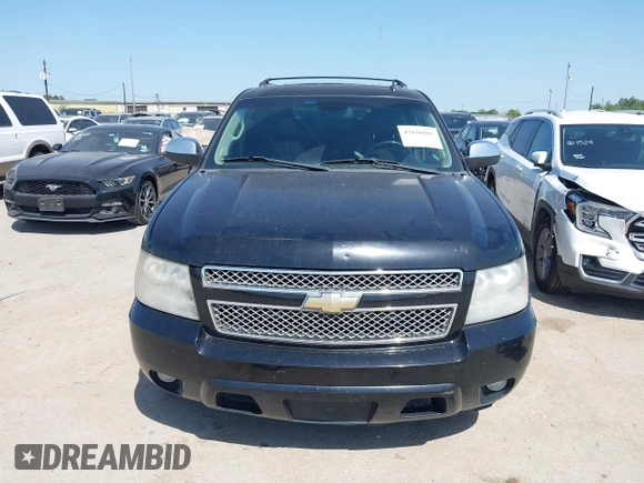 2011 Chevrolet Suburban LT with VIN 1GNSCJE09BR235355, listed as a IAAI auction lot 42030105 with 308,576 mi miles. Bid and sale history available at carsss.com. Image 12.