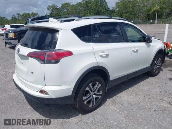 2016 Toyota RAV4 LE with VIN JTMZFREV2GJ096782, listed as a IAAI auction lot 41945319 with 76,866 mi miles. Bid and sale history available at carsss.com. Image 4.