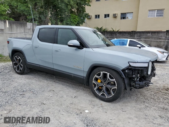 2022 Rivian R1T Launch Edition z VIN 7FCTGAALXNN004228, wystawiony jako Copart lot #43226985 z przebiegiem 4 mil mil oraz Szkody całkowita. Historia ofert i sprzedaży dostępna na DreamBid. Obrazek 4.