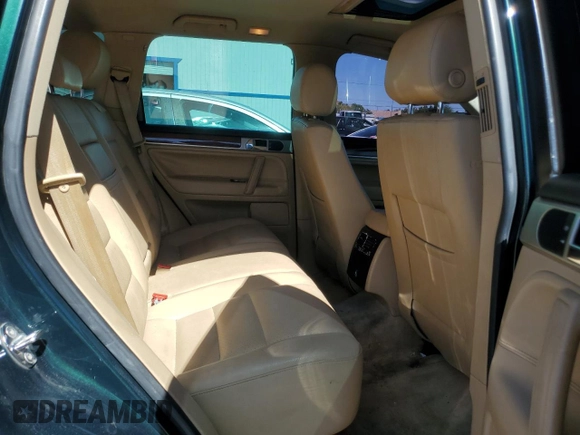 2005 Volkswagen Touareg z VIN WVGBG77L25D010568, wystawiony jako Copart lot #57268755 z przebiegiem 229 928 mil mil oraz Szkoda całkowita • Salvage title. Historia ofert i sprzedaży dostępna na DreamBid. Obrazek 11.